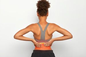 dolor de espalda al entrenar en zona lumbar y sobrecarga muscular