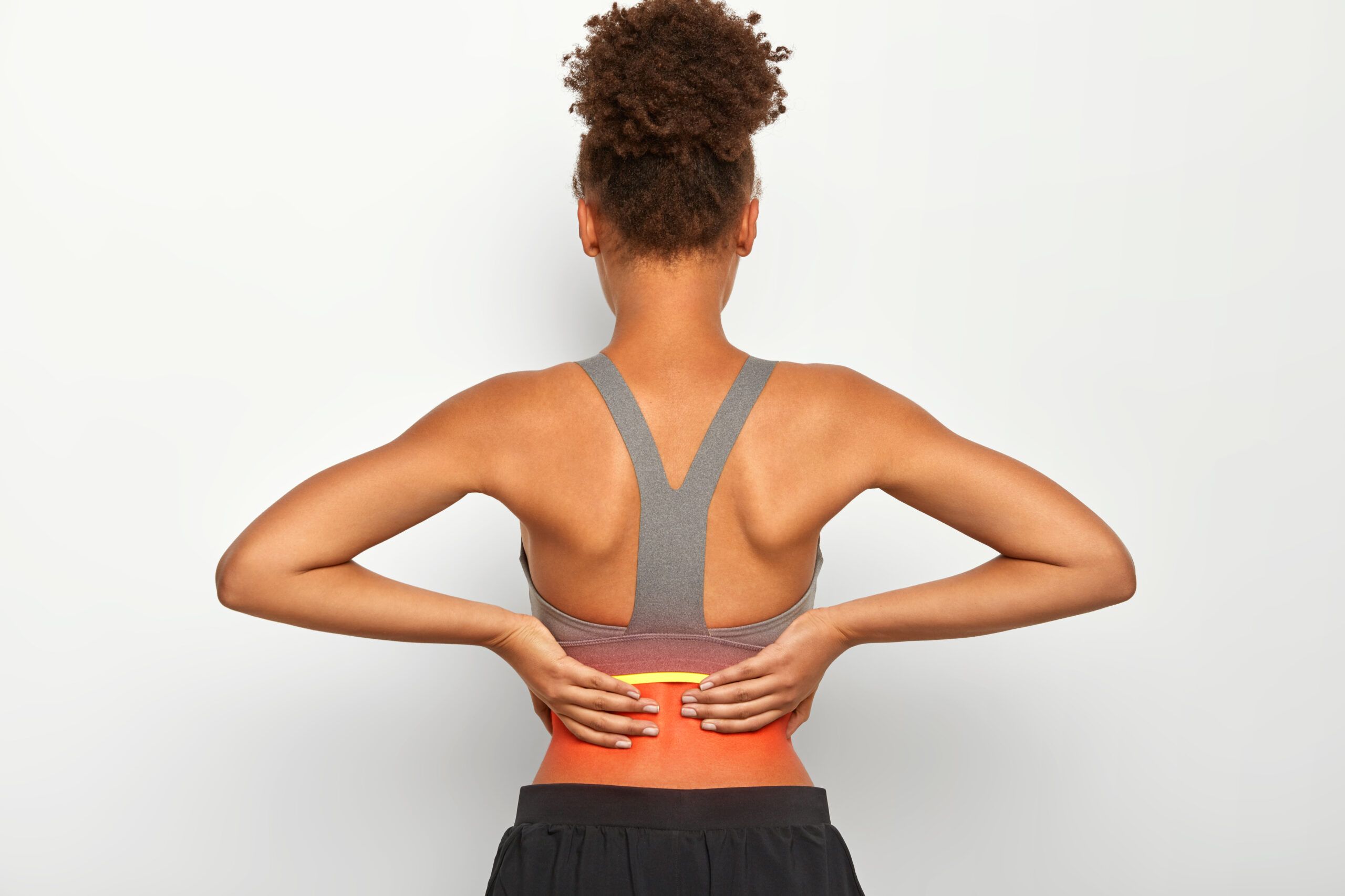 dolor de espalda al entrenar en zona lumbar y sobrecarga muscular